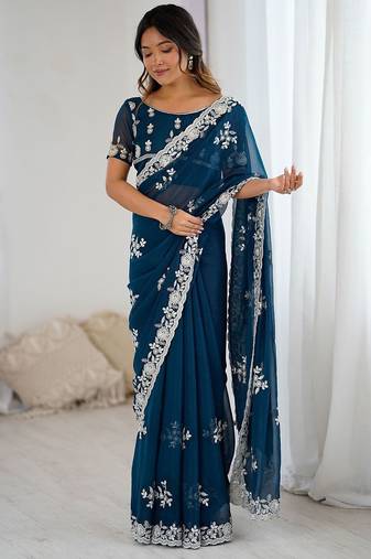 Teal embellished party wear saree with matching blouse