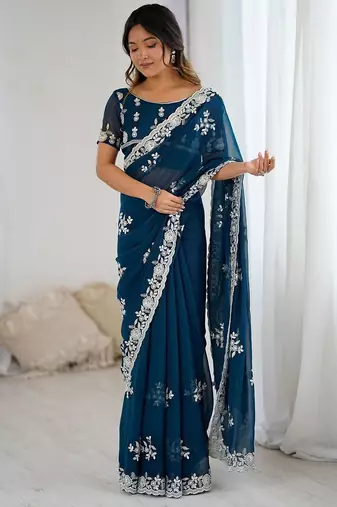 Teal embellished party wear saree with matching blouse