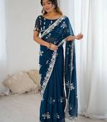 Teal embellished party wear saree with matching blouse