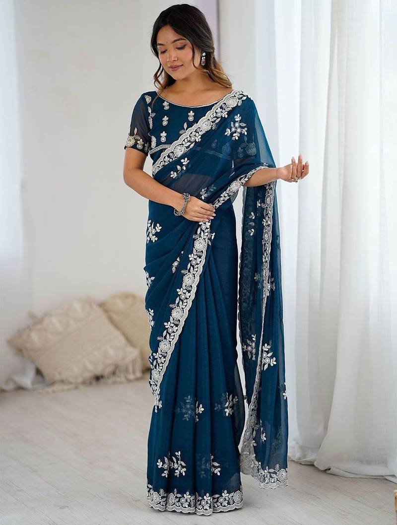 Teal embellished party wear saree with matching blouse