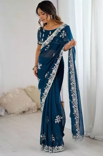 Teal embellished party wear saree with matching blouse