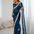 Teal embellished party wear saree with matching blouse