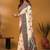 Off white paisley printed banarasi saree with unstitched blouse piece