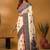 Off white paisley printed banarasi saree with unstitched blouse piece