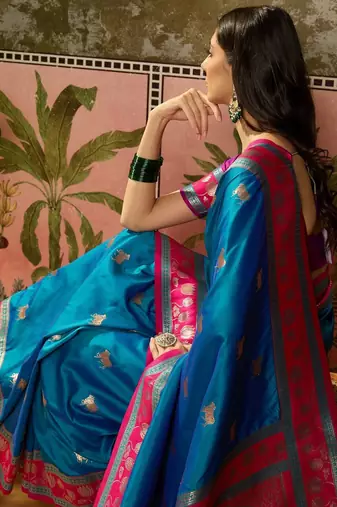 Teal zari woven design saree with contrast unstitched blouse