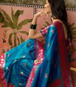 Teal zari woven design saree with contrast unstitched blouse