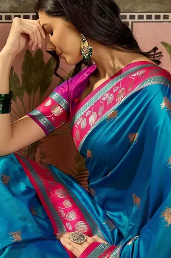 Teal zari woven design saree with contrast unstitched blouse