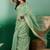 Green ethnic motif zari woven kanjeevaram saree with blouse