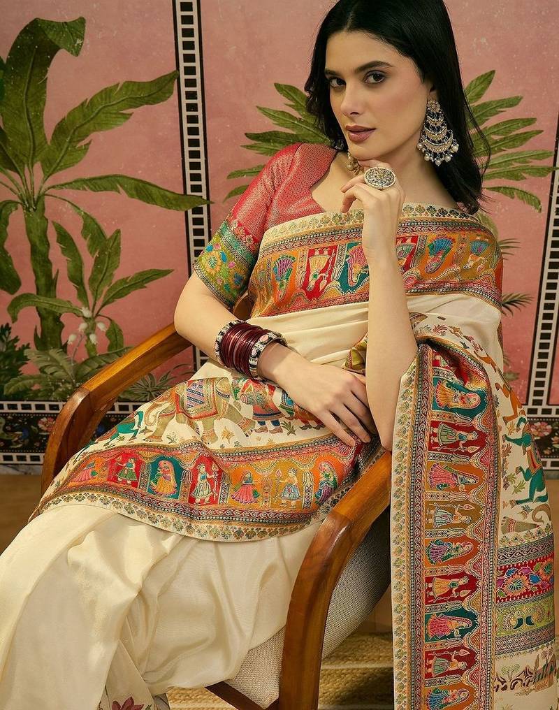 Off white position printed zari weaving saree with contrast blouse piece