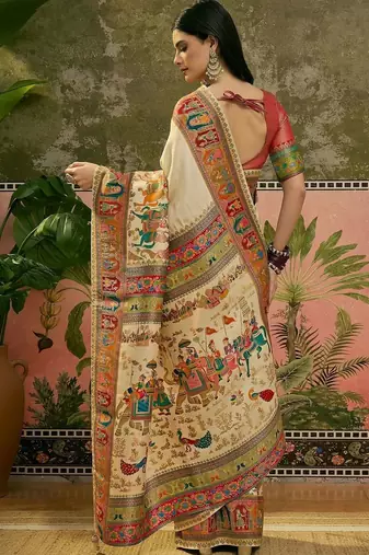 Off white position printed zari weaving saree with contrast blouse piece