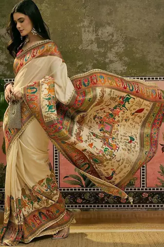 Off white position printed zari weaving saree with contrast blouse piece