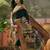 Black position printed zari weaving saree with contrast blouse piece