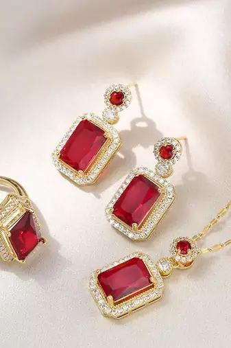 Gold plated red cubic zirconia studded pendant chain drop earrings