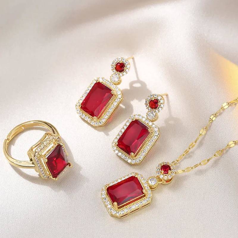 Gold plated red cubic zirconia studded pendant chain drop earrings