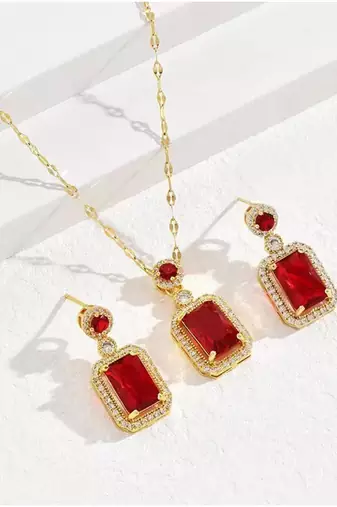 Gold plated red cubic zirconia studded pendant chain drop earrings