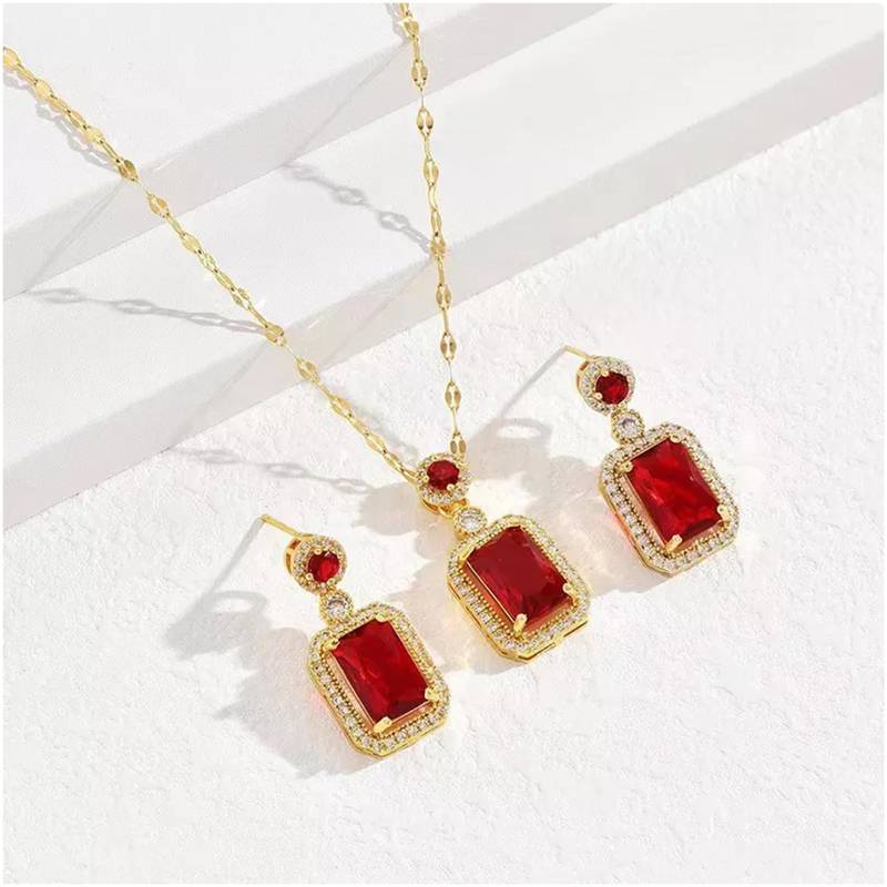 Gold plated red cubic zirconia studded pendant chain drop earrings