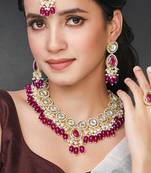 Synthetic stone & purple beads studded necklace earrings maangtikka