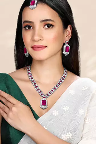 Silver plated rani pink cubic zirconia & synthetic stone studded