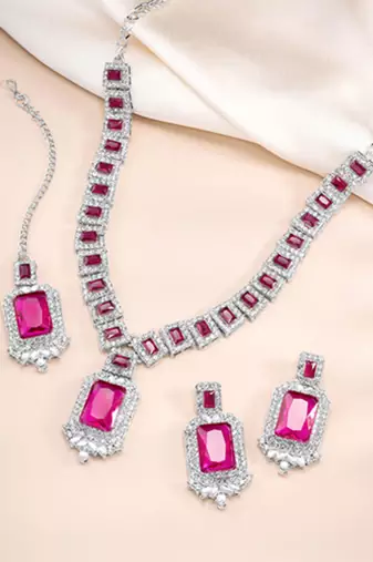 Silver plated rani pink cubic zirconia & synthetic stone studded