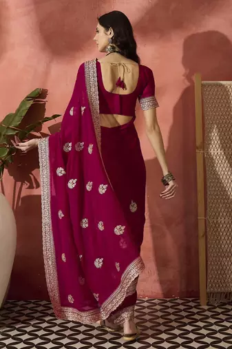 Pink ethnic motifs embellished  georgette saree