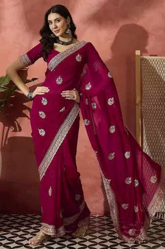 Pink ethnic motifs embellished  georgette saree
