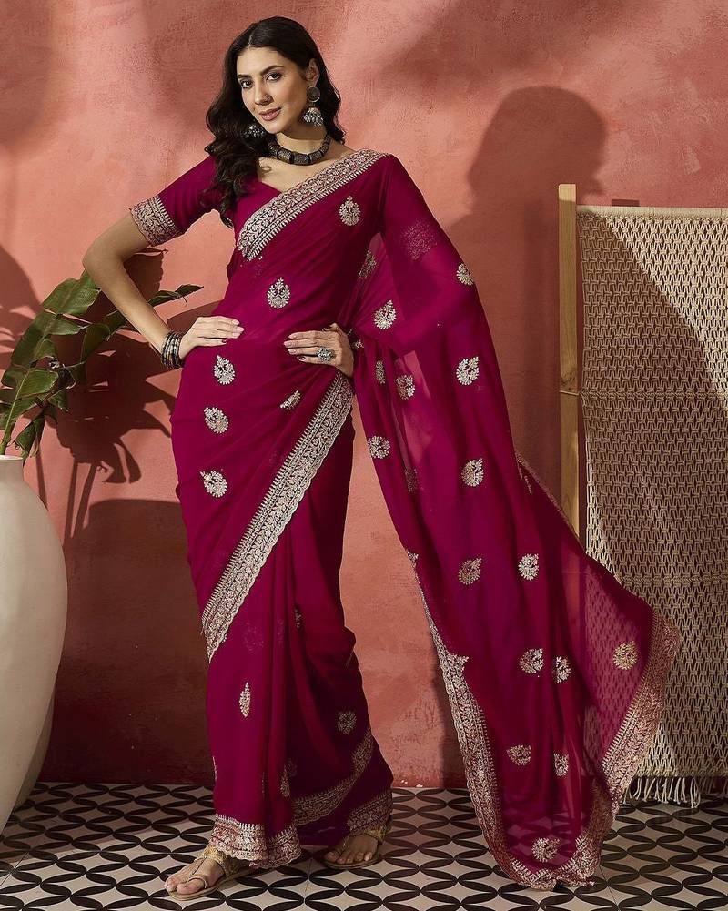 Pink ethnic motifs embellished  georgette saree