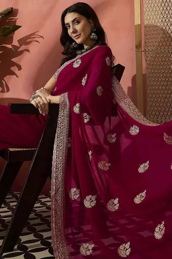 Pink ethnic motifs embellished  georgette saree