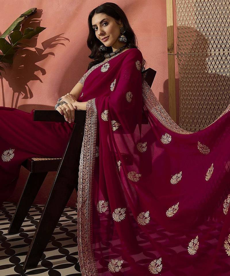 Pink ethnic motifs embellished  georgette saree