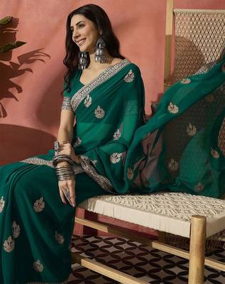 Green ethnic motifs embroidered saree 1