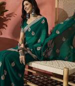 Green ethnic motifs embroidered saree