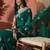 Green ethnic motifs embroidered saree