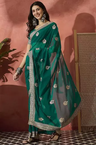 Green ethnic motifs embroidered saree