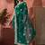 Green ethnic motifs embroidered saree