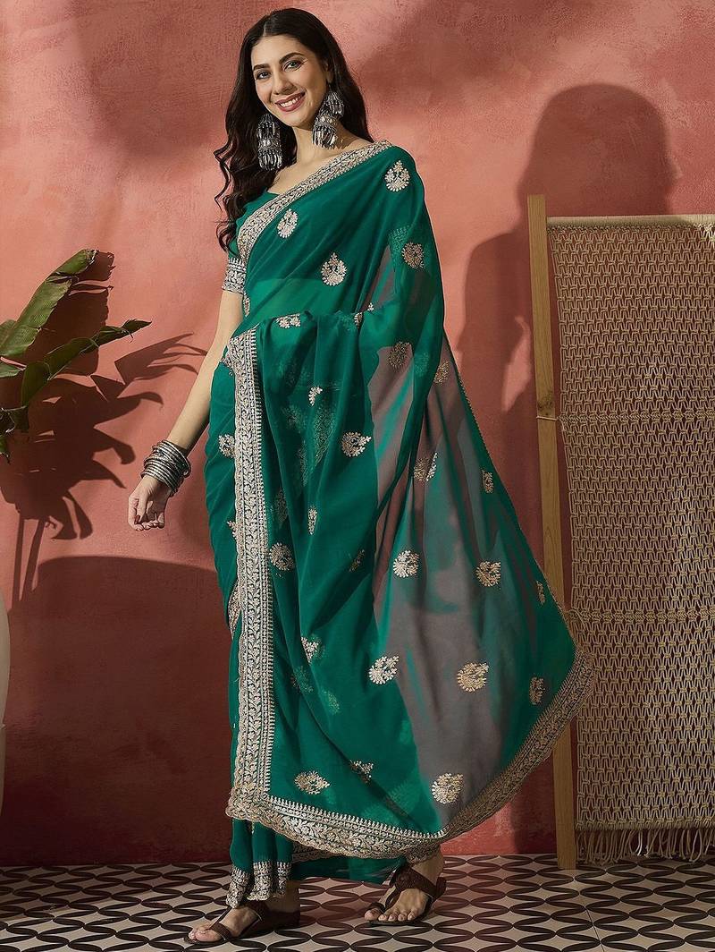 Green ethnic motifs embroidered saree