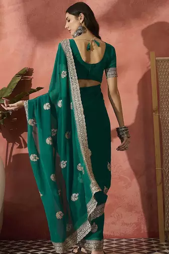 Green ethnic motifs embroidered saree