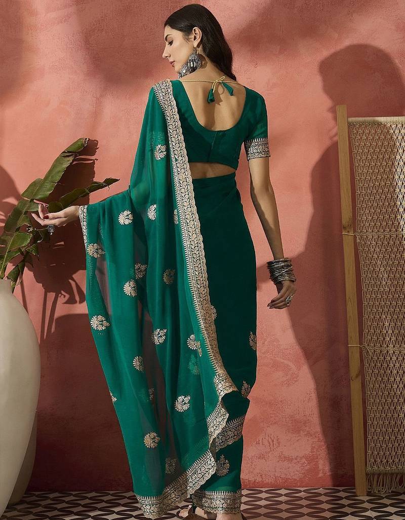 Green ethnic motifs embroidered saree