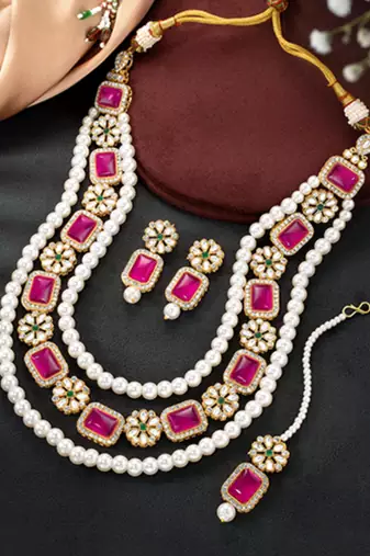 Gold plated rani pink & green kundan synthetic stone & beads studded