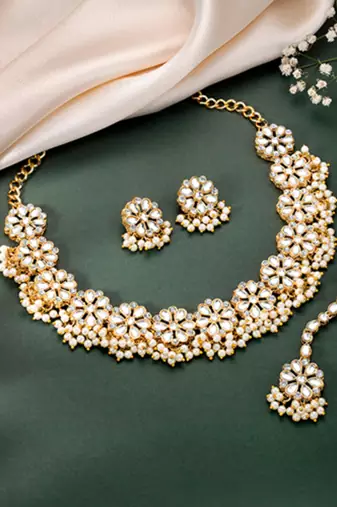 Gold plated white kundan & beads studded necklace earrings