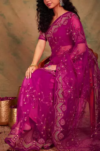 Pink ethnic motifs embroidered net sarees