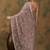 Beige floral embroidered net saree