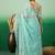 Sea green embroidered saree with blouse piece