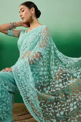 Sea green embroidered saree with blouse piece
