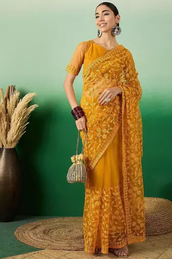 Mustard embroidered net saree with blouse piece