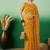Mustard embroidered net saree with blouse piece