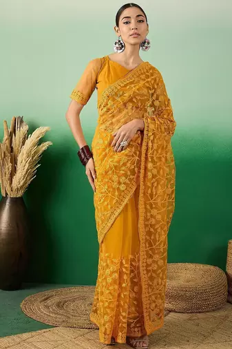 Mustard embroidered net saree with blouse piece