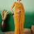 Mustard embroidered net saree with blouse piece