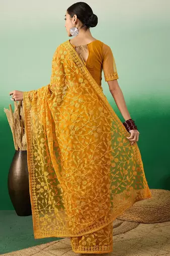 Mustard embroidered net saree with blouse piece