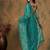 Teal embroidered saree with blouse piece