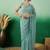 Teal embroidered beads and stones net saree