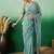 Teal embroidered beads and stones net saree
